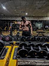 Athlete training with dumbbells at YC's Powerhouse Gym